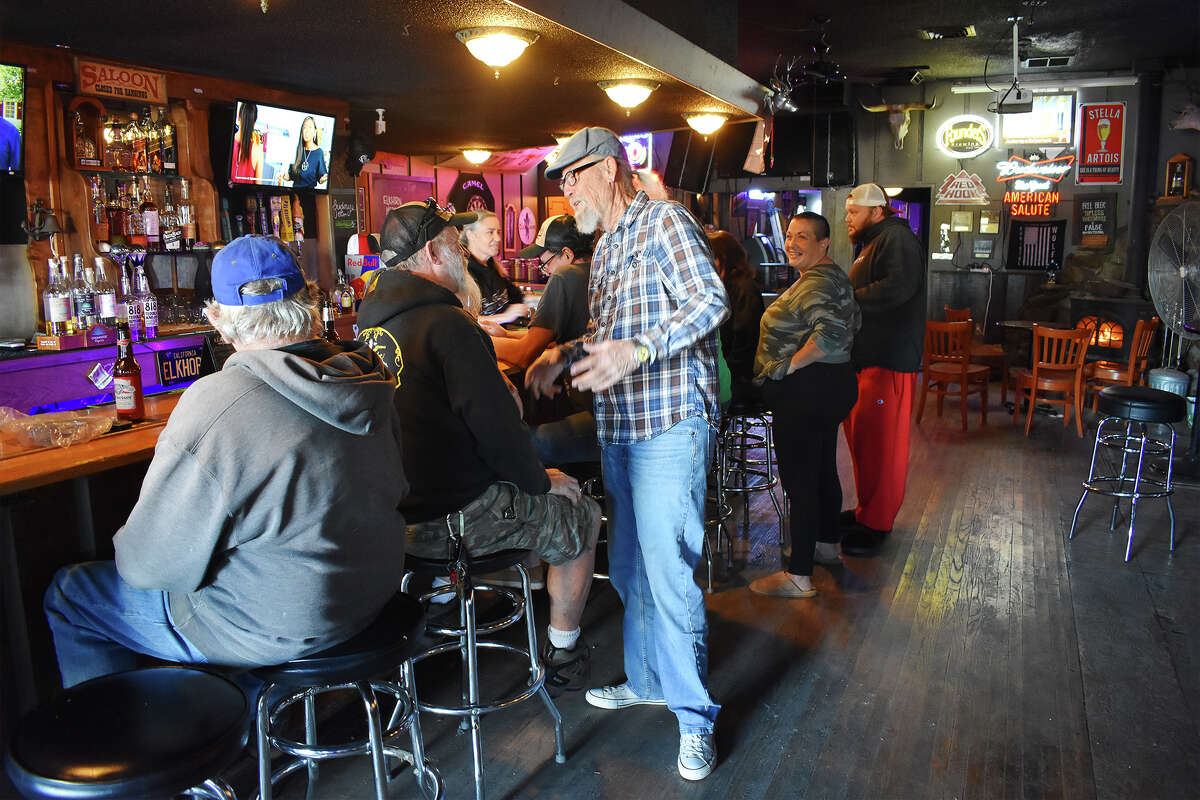 Patrons at the Elkhorn Bar in San Miguel congregate on a weekend afternoon. 