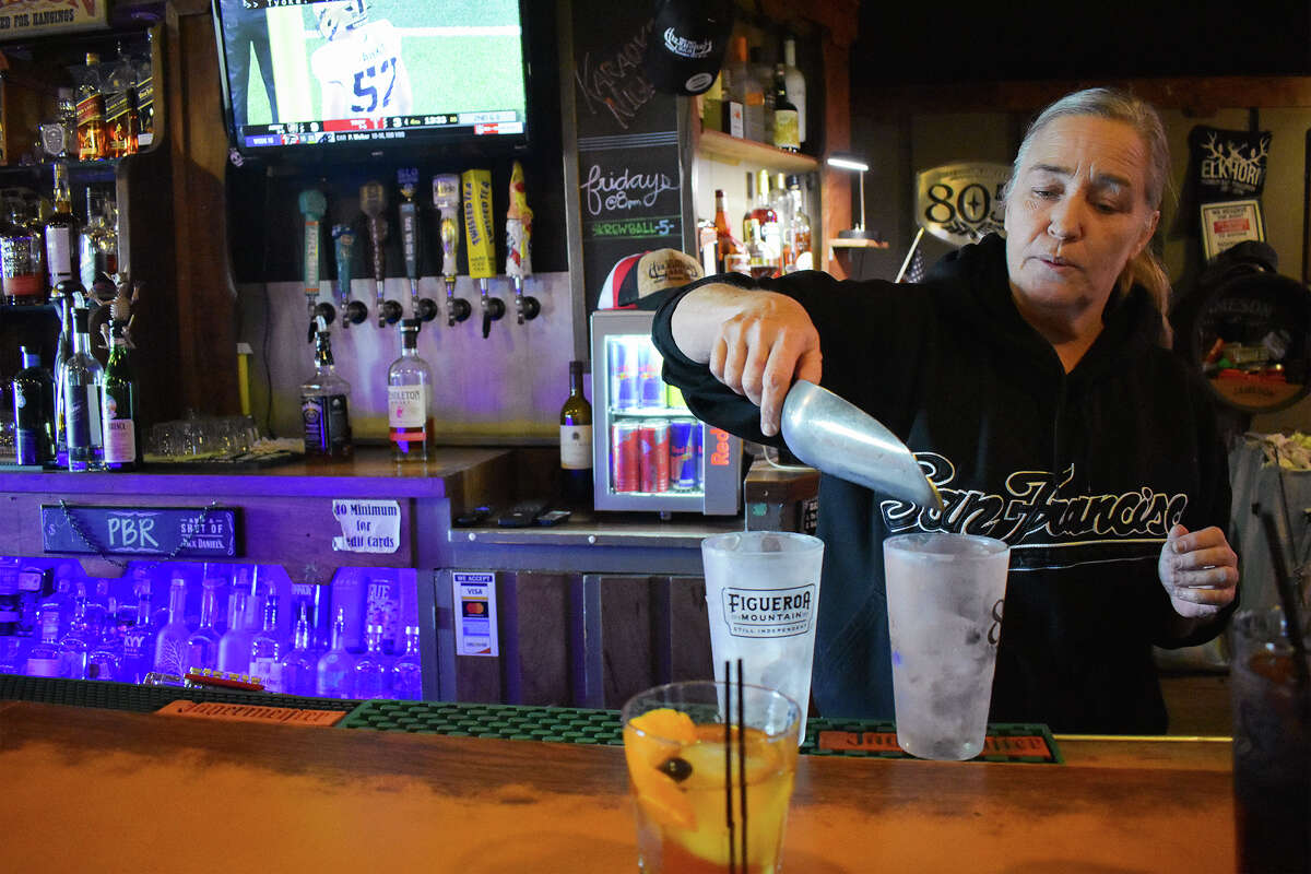 A bartender at the Elkhorn in San Miguel mixes a couple of drinks on a Saturday afternoon. 