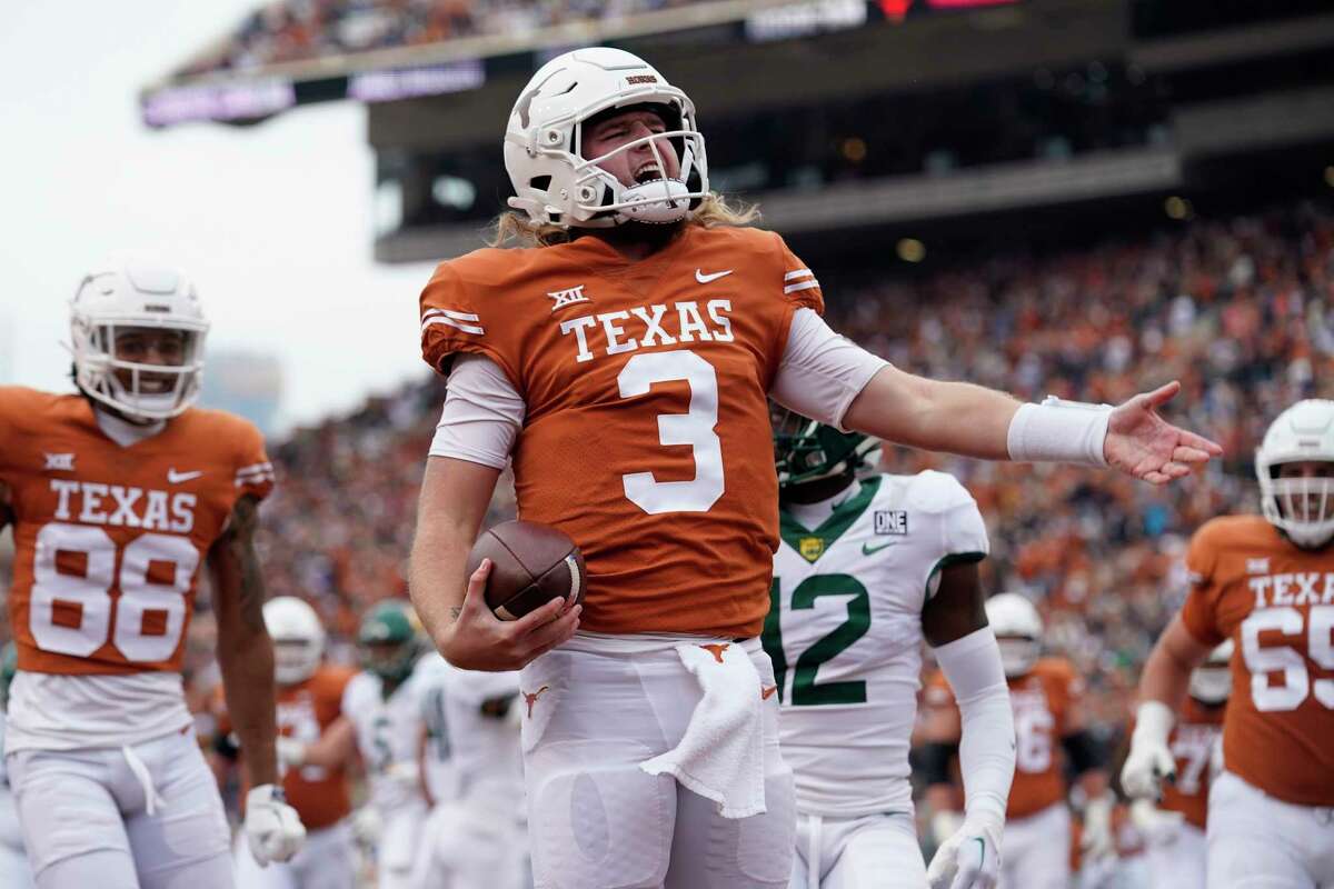 Texas quarterback Quinn Ewers (3) celebrates after scoring a touchdown against Baylor during the first half of an NCAA college football game in Austin, Texas, Friday, Nov. 25, 2022. (AP Photo/Eric Gay)