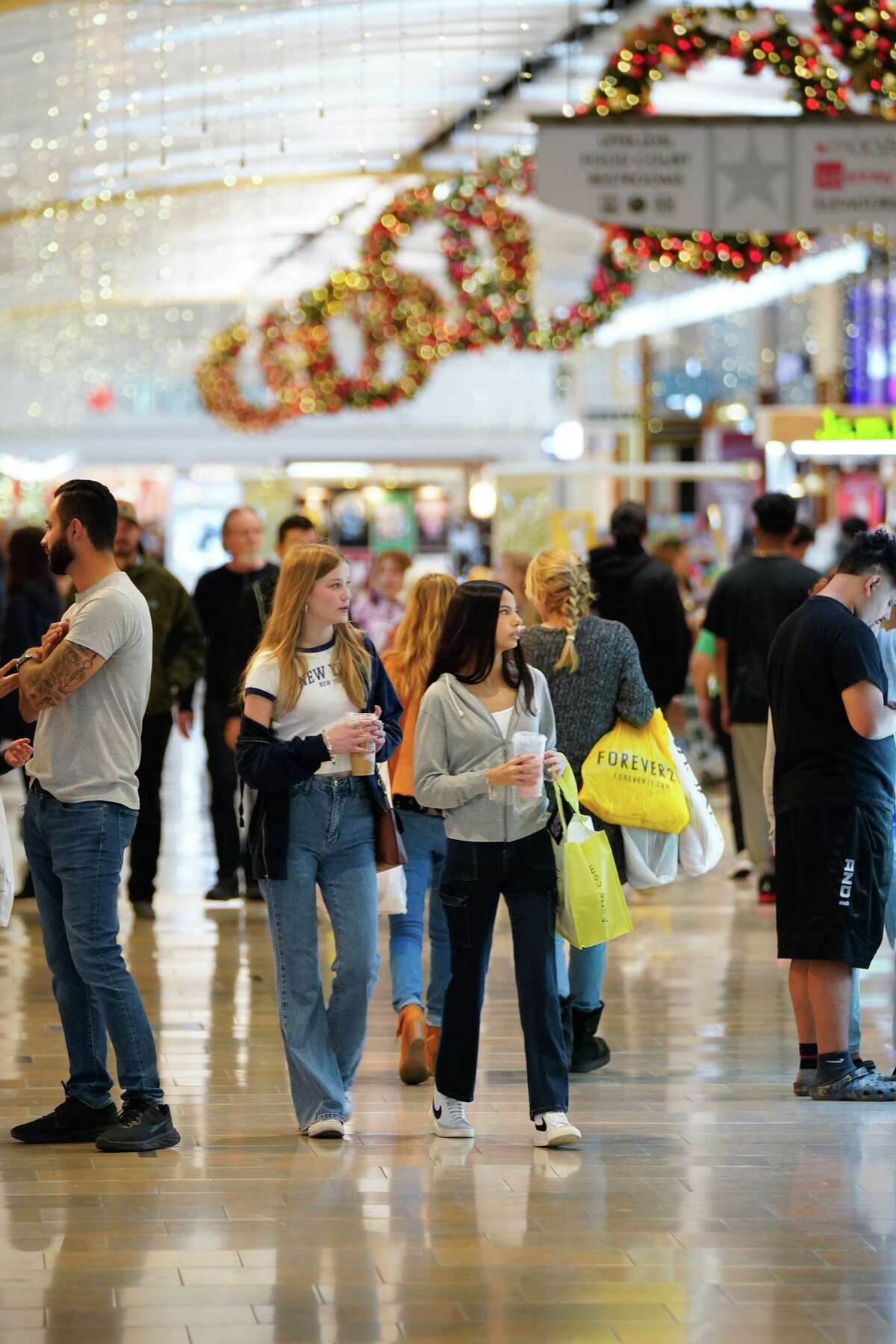 Shoppers stroll through North Star Mall early Friday searching for Black Friday deals.