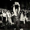 Calhoun coach Ric Johns carries the Class 1A football state championship trophy above his head while leading the Warriors into a packed gym on a November Friday night in Hardin in 1992. Earlier that day, Calhoun beat Poplar Grove North Boone to complete a 14-0 season with the school's first state title.