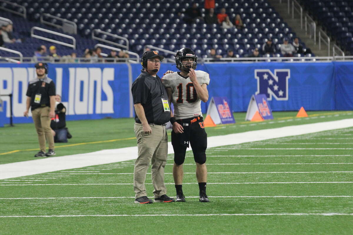 Ubly coach Eric Sweeney calls a play to Evan Peruski in the Division 8 State Championship game. Sweeney was named the TSA's 11-player coach of the year, while Peruski was named the TSA's 11-player Player of the Year.