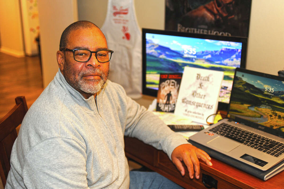 Vince Churchill sits in his home office in Springfield, where he does most of the writing for his books.