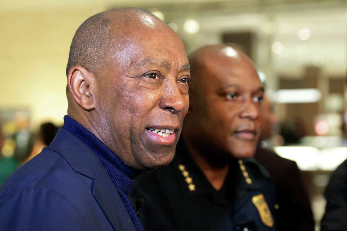 Houston mayor Sylvester Turner, left, and police chief Troy Finner, right, take a walking tour inside the Galleria Mall interacting with shoppers and store employees to emphasize security and safety during the shopping season Friday, Nov. 25, 2022 in Houston, TX.