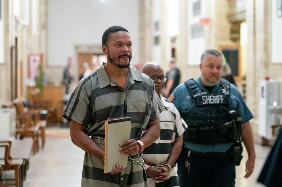 Brian Betts and Celester McKinney are led into the courtroom before their hearing at the Wyandotte County Courthouse in Kansas City, Kan., on Oct. 24, 2022.