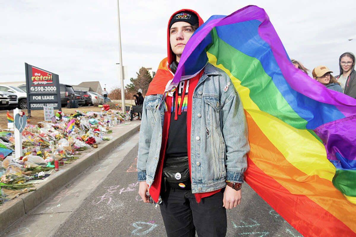 Robin L stands at a memorial to the shooting victims of Club Q in Colorado Springs. "It's a lot of conflicting emotions (about being there)," said Robin. "We have to have space to grieve, but we have to have space to have hope."