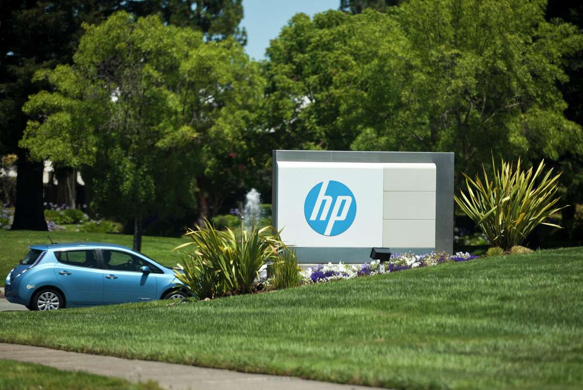 A car enters the Hewlett-Packard headquarters in Palo Alto, Calif., on July 23, 2014. In 2015, Hewlett-Packard spun off its enterprise business and renamed its printer and personal computer business HP.