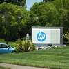 A car enters the Hewlett-Packard headquarters in Palo Alto, CA on July 23, 2014.
