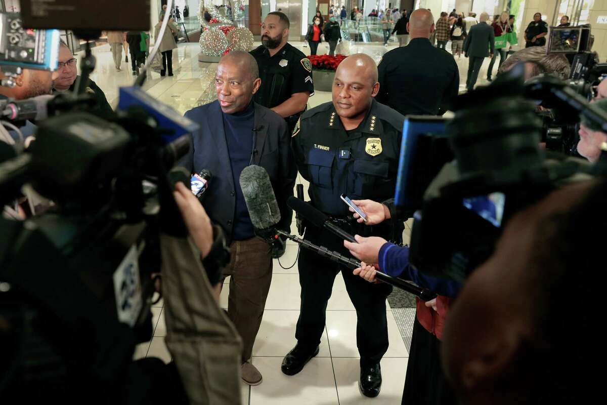 Houston mayor Sylvester Turner, left, and police chief Troy Finner, right, hold a press conference after a walking tour inside the Galleria Mall, interacting with shoppers and store employees to emphasize security and safety during the shopping season Friday, Nov. 25, 2022 in Houston, TX.