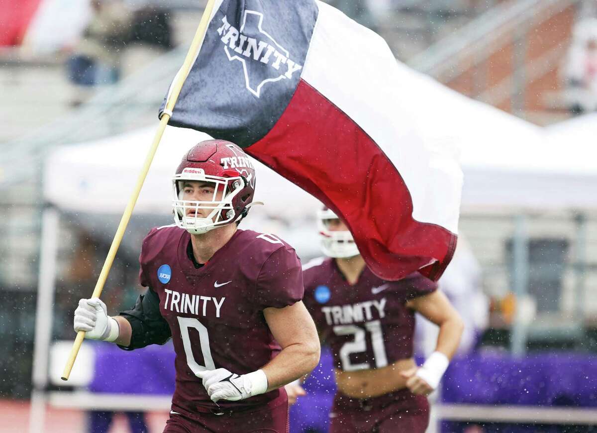 Trinity linebacker (0) leads the team onto the field prior to the first round NCAA Division 3 playoff game against Hardin-Simmons Saturday, Nov. 19, 2022, at Trinity Stadium in San Antonio, Texas.
