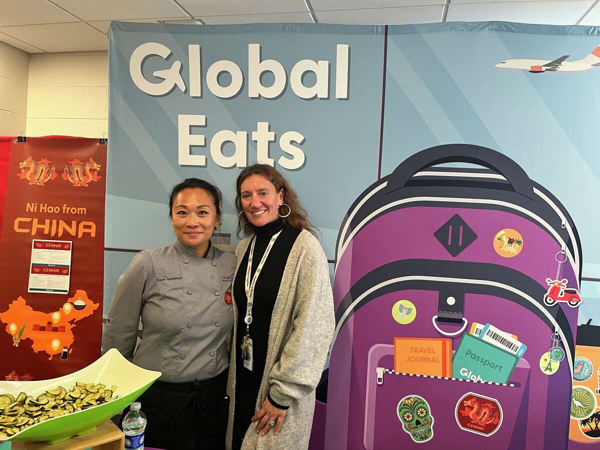 Chase Sobelman, left, the New England regional chef for Chartwells, and Jill Kress, the food service liaison at Norwalk Public Schools, at Naramake Elementary School on the Chinese cuisine day.