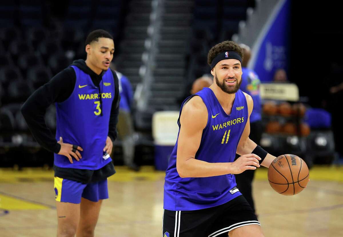 Klay Thompson, right, and Jordan Poole, left, work together on their three point shooting as the Golden State Warriors practiced before the NBA Finals get underway later in the week at Chase Center in San Francisco, Calif., on Monday, May 30, 2022.