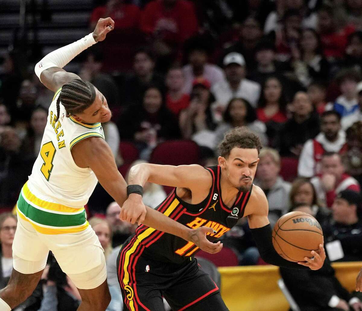 Houston Rockets guard Jalen Green (4) fouls Atlanta Hawks guard Trae Young (11) during the second half of an NBA basketball game at Toyota Center on Friday, Nov. 25, 2022 in Houston .