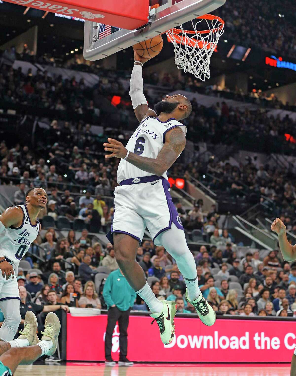SAN ANTONIO, TX - NOVEMBER 25: LeBron James #6 of the Los Angeles Lakers scores against the San Antonio Spurs in the first half at AT&T Center on November 25, 2022 in San Antonio, Texas. NOTE TO USER: User expressly acknowledges and agrees that, by downloading and or using this photograph, User is consenting to terms and conditions of the Getty Images License Agreement. (Photo by Ronald Cortes/Getty Images)