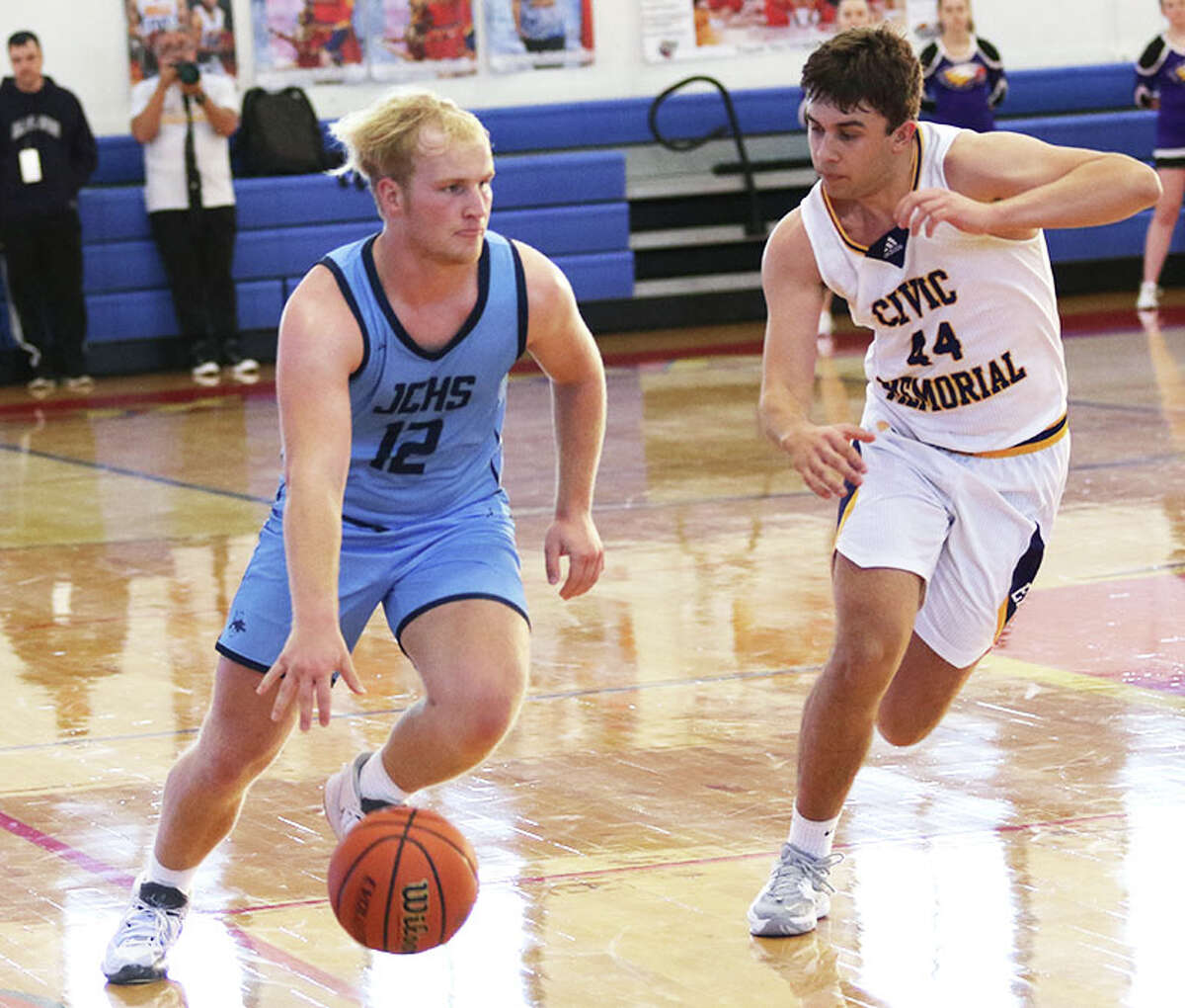 Jersey's Tanner Brunaugh (left) led his team with 16 points, inclduing four 3-point baskets, in its win over East Alton-Wood river Wednesday in Jerseyville. He is shown driving against CM's Dalton Buhs earlier this season in the Hoopsgiving Classic in Roxana. The Panthers will face CM again on Friday at Havens Gym.