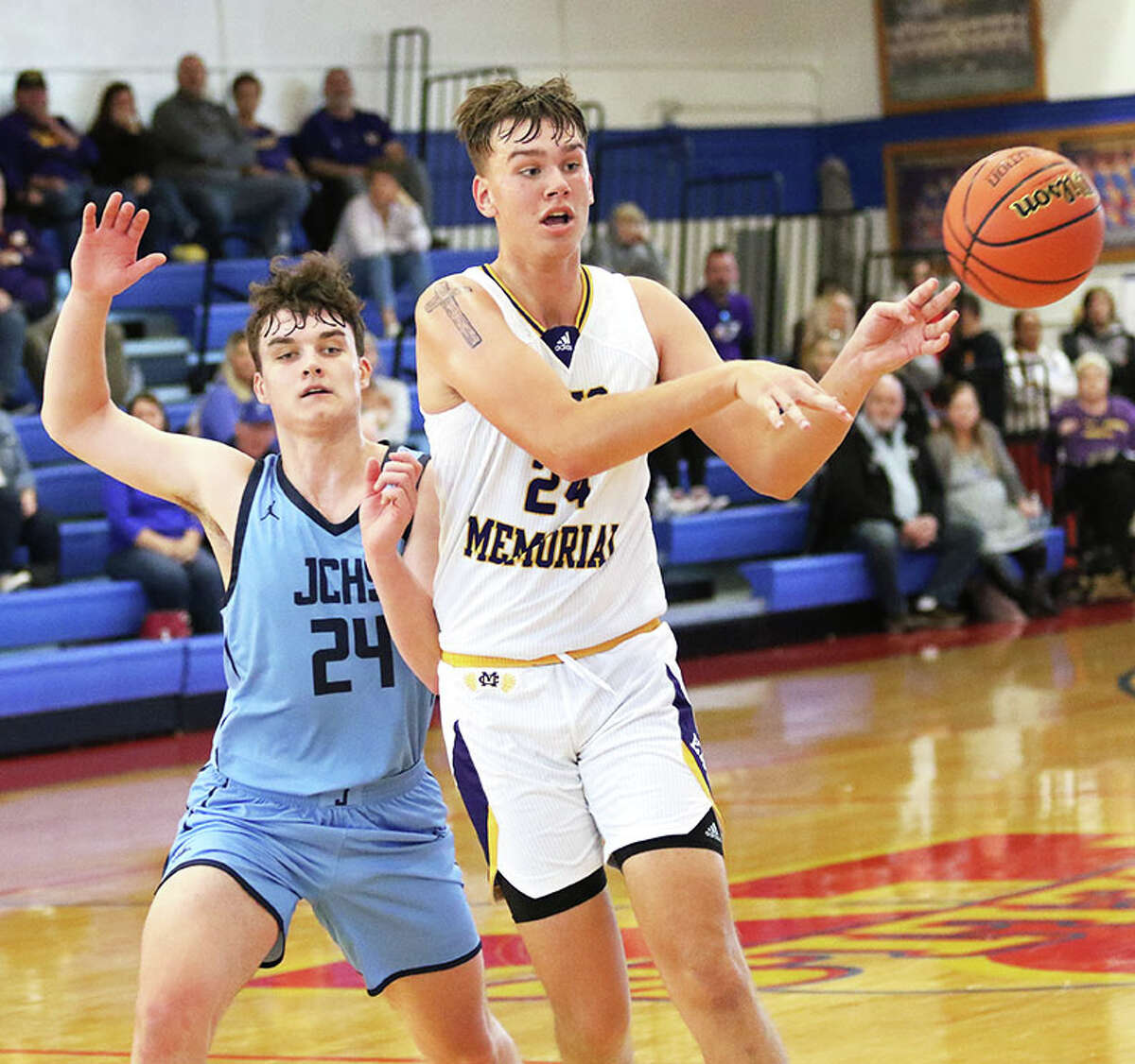 CM's Sam Buckley (right) passes to a teammate on a give-and-go while being defended by Jersey's Ayden Kanallakan in the Hoopsgiving Classic on Friday at Milazzo Gym in Roxana.