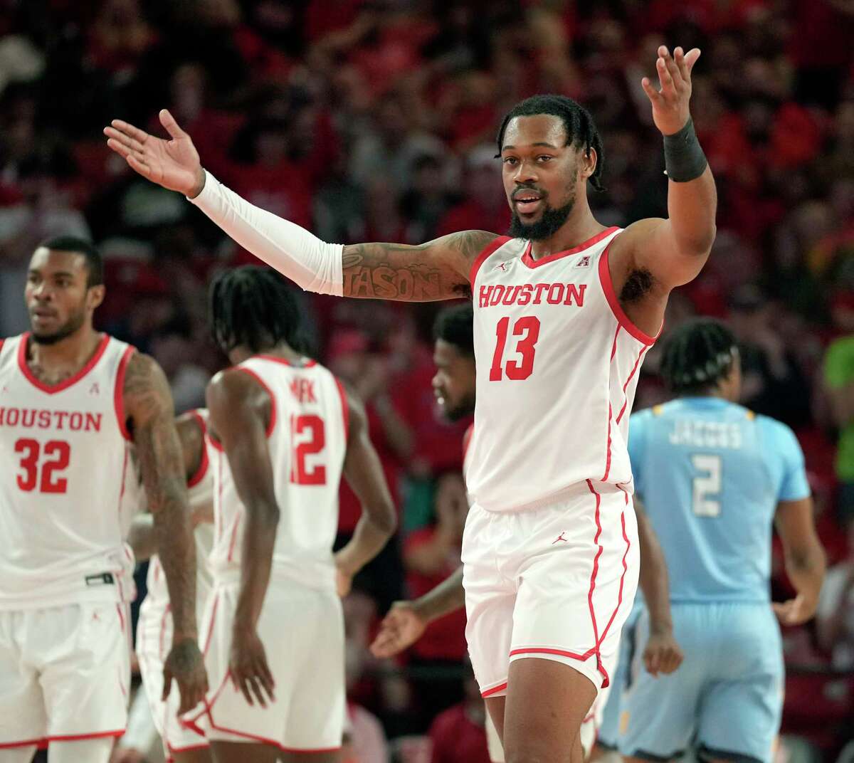 Forward J'Wan Roberts (13) and the rest of the Cougars appreciate the big home-court advantage Fertitta Center has wrought for UH.