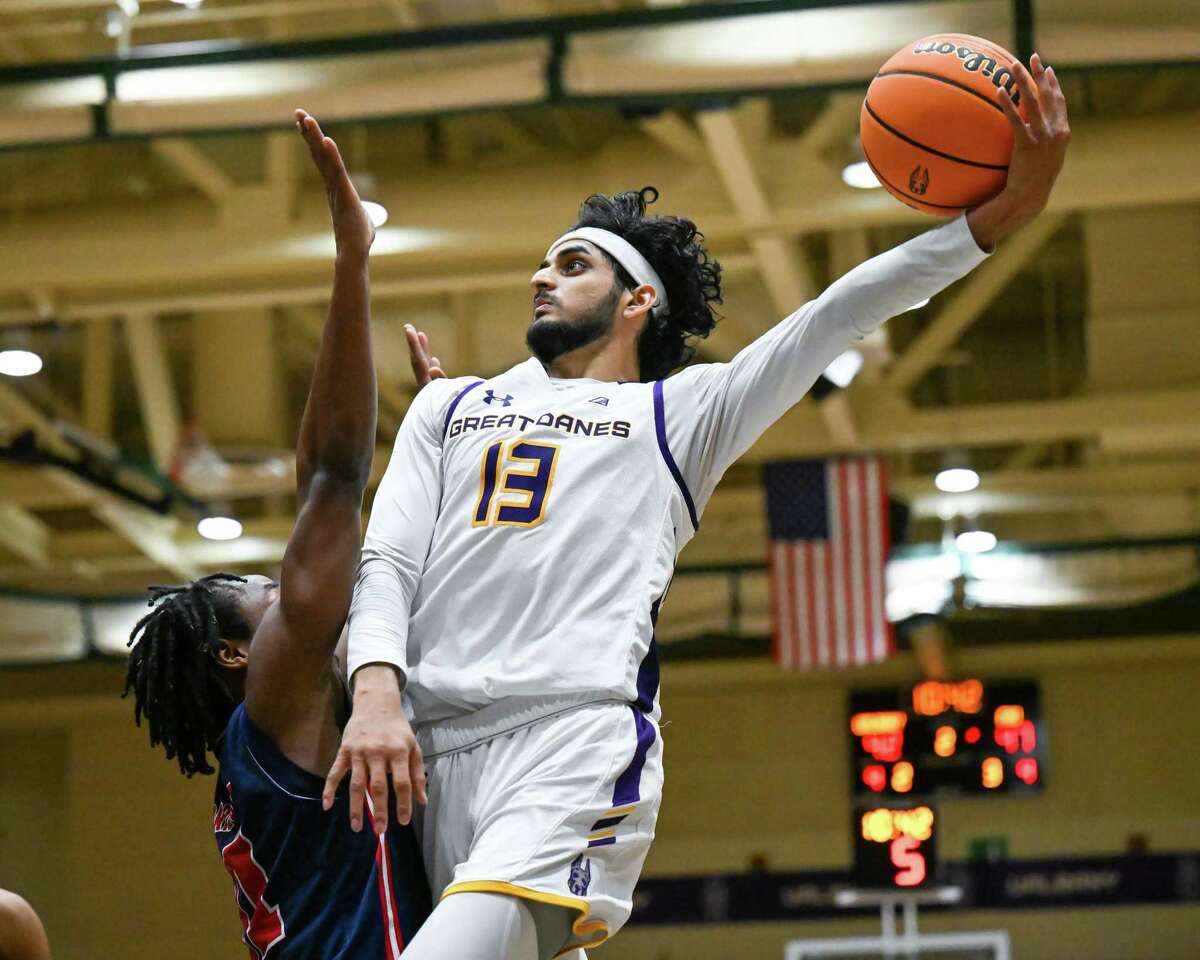 UAlbany graduate student Sarju Patel makes a move in front of Florida Atlantic University senior Michael Forrest during game on Saturday, Nov. 26, 2022, at Hudson Valley Community College in Troy, N.Y. Patel finished with a game-high 23 points.