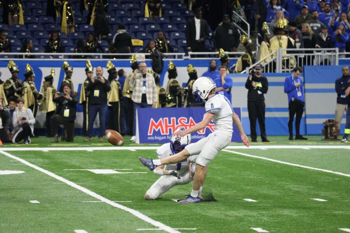 Gladwin's Treyton Siegert boots a 21-yard field goal to give the Flying G's the lead in the final seconds of Saturday's Division 5 state championship game against Frankenmuth at Ford Field in Detroit, Nov. 26, 2022.