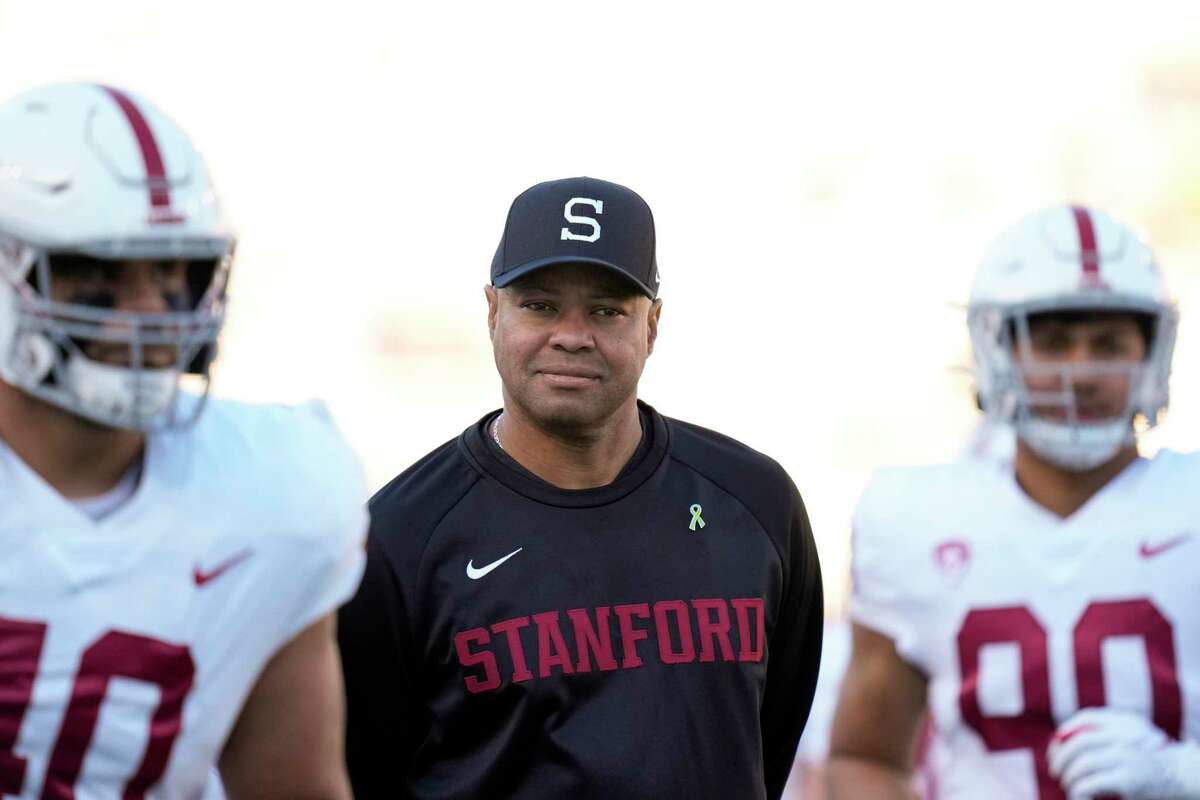 Stanford head coach David Shaw, middle, watches during warmup before an NCAA college football game against California in Berkeley, Calif., Saturday, Nov. 19, 2022. (AP Photo/Godofredo A. Vásquez)