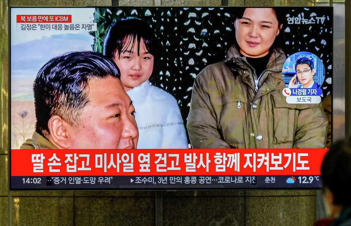 A TV screen shows North Korea's KCNA released a picture of North Korean leader Kim Jong Un (L), his wife Ri Sol Ju (R), and his daughter Kim Chu-ae during a news program at the Yongsan Railway Station in Seoul, South Korea. (Photo by KIM Jae-Hwan/SOPA Images/LightRocket via Getty Images)