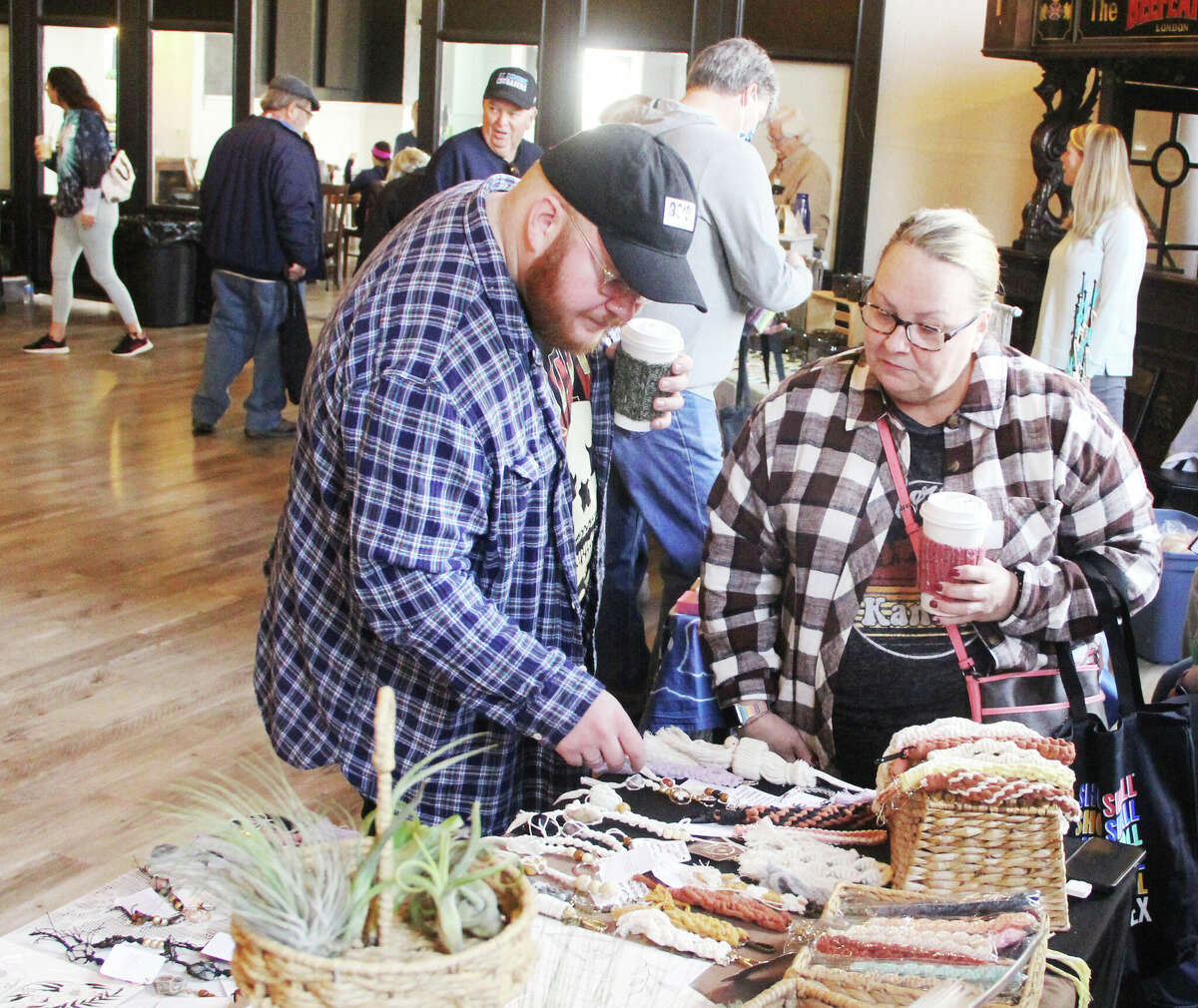 Wyatt Martin, of Kansas City, Missouri, and his mother, Toni Barbier, of Brighton, browse at the Post Commons during the annual Green Gift Bazaar, held Saturday at the Post Commons and Jacoby Arts Center. A joint effort by Alton Main Street and the Sierra Club for 20 years, the event offered environmentally friendly goods and is held in conjunction with Small Business Saturday.