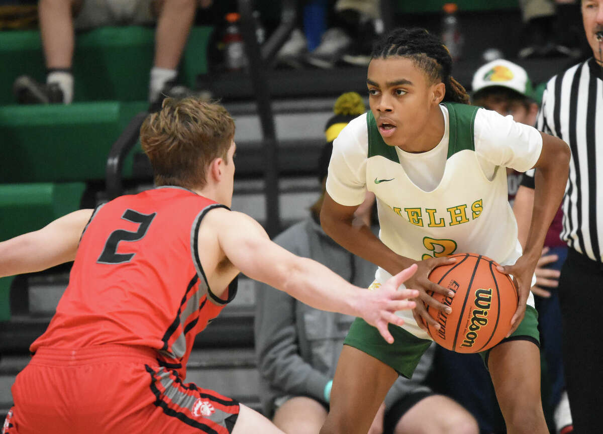 Metro-East Lutheran's MJ Bell holds the ball against Kirkwood in the opening game of the MELHS Thanksgiving Shootout on Saturday in Edwardsville.