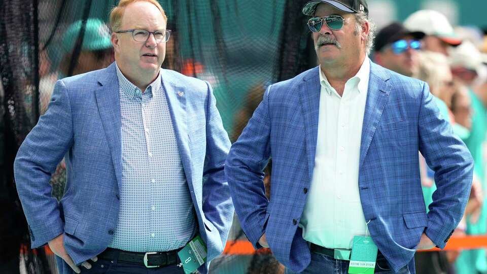 Houston Texans President Greg Grissom, left, and CEO Cal McNair stand on the sidelines during warm ups before an NFL football game against the Miami Dolphins on Sunday, Nov. 27, 2022, in Miami Gardens, Fla.