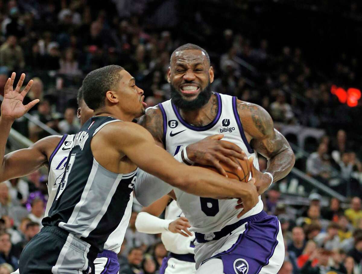 San Antonio Spurs Keldon Johnson (3) tries to stop Los Angeles Lakers Lebron James (6) in the first half on Saturday, Nov. 26, 2022 at AT&T Center. Los Angeles Lakers defeated the San Antonio Spurs 143-138.