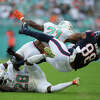 Miami Dolphins safety Eric Rowe (21) knocks the ball loose from Houston Texans tight end Jordan Akins (88) during the game between the Houston Texans and the Miami Dolphins on Sunday, November 27, 2022 at Hard Rock Stadium in Miami Gardens, Florida.