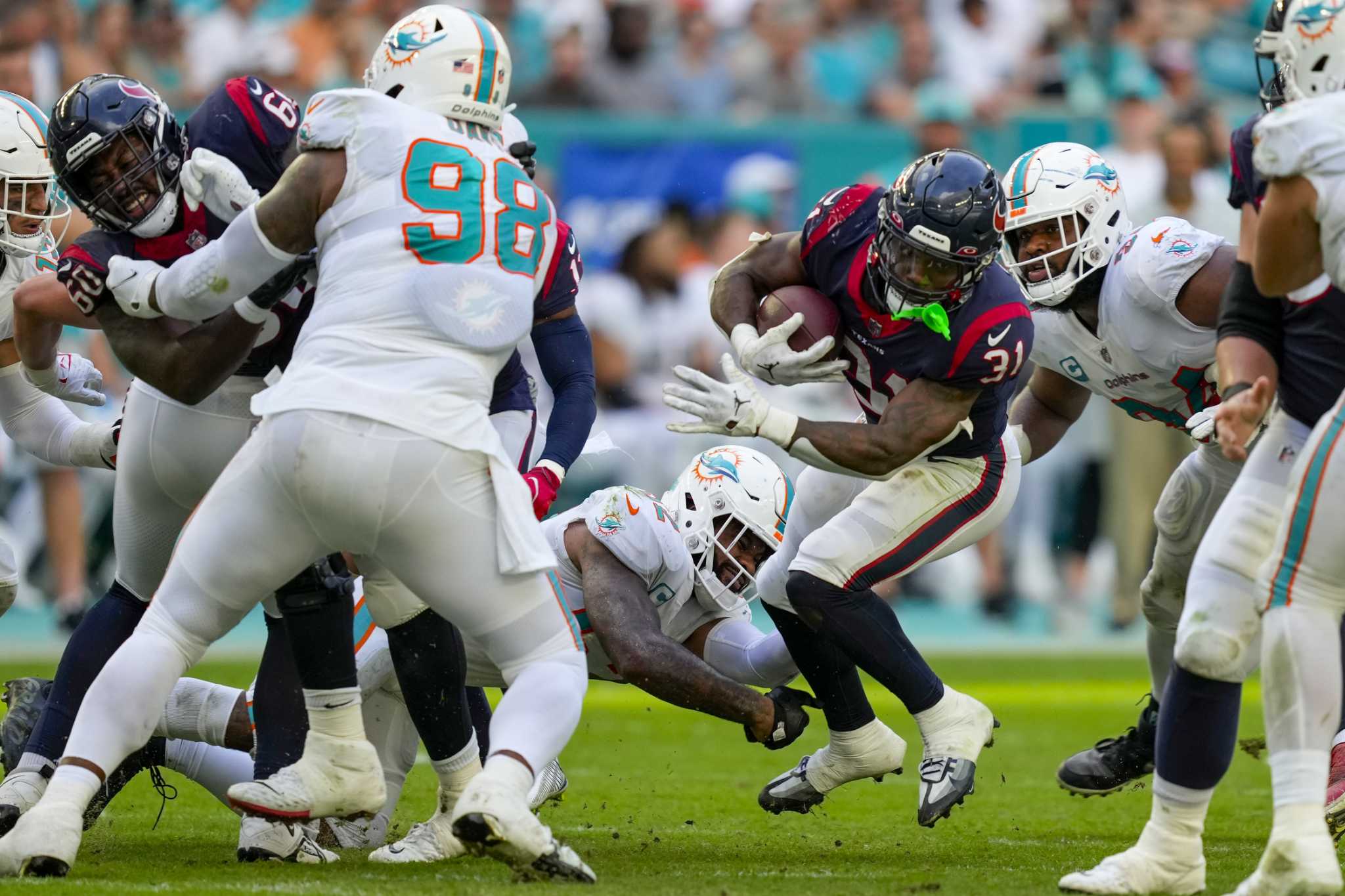 Houston Texans running back Dameon Pierce runs with the ball against the  Miami Dolphins during the first half of an NFL preseason football game,  Saturday, Aug. 19, 2023, in Houston. (AP Photo/Eric