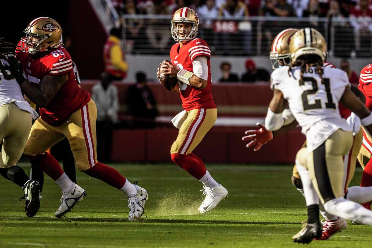 San Francisco 49ers quarterback Jimmy Garoppolo (10) looks to make a pass during the first half of an NFL football game against New Orleans Saints in Santa Clara, Calif., Sunday, Nov. 27, 2022.
