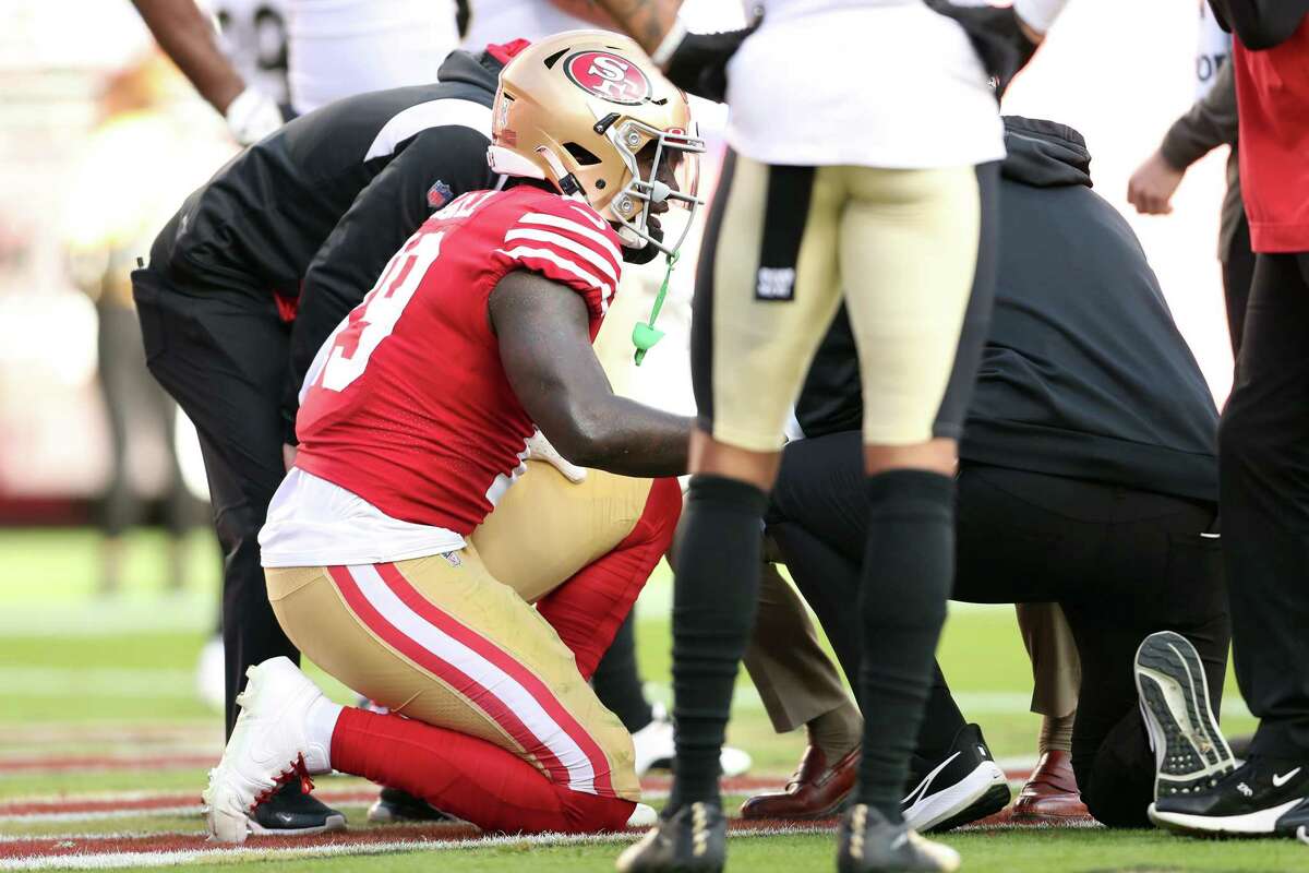 San Francisco 49ers wide receiver Deebo Samuel (19) rides a stationary bike  on the sideline during the second half of an NFL football game against the  New Orleans Saints in Santa Clara