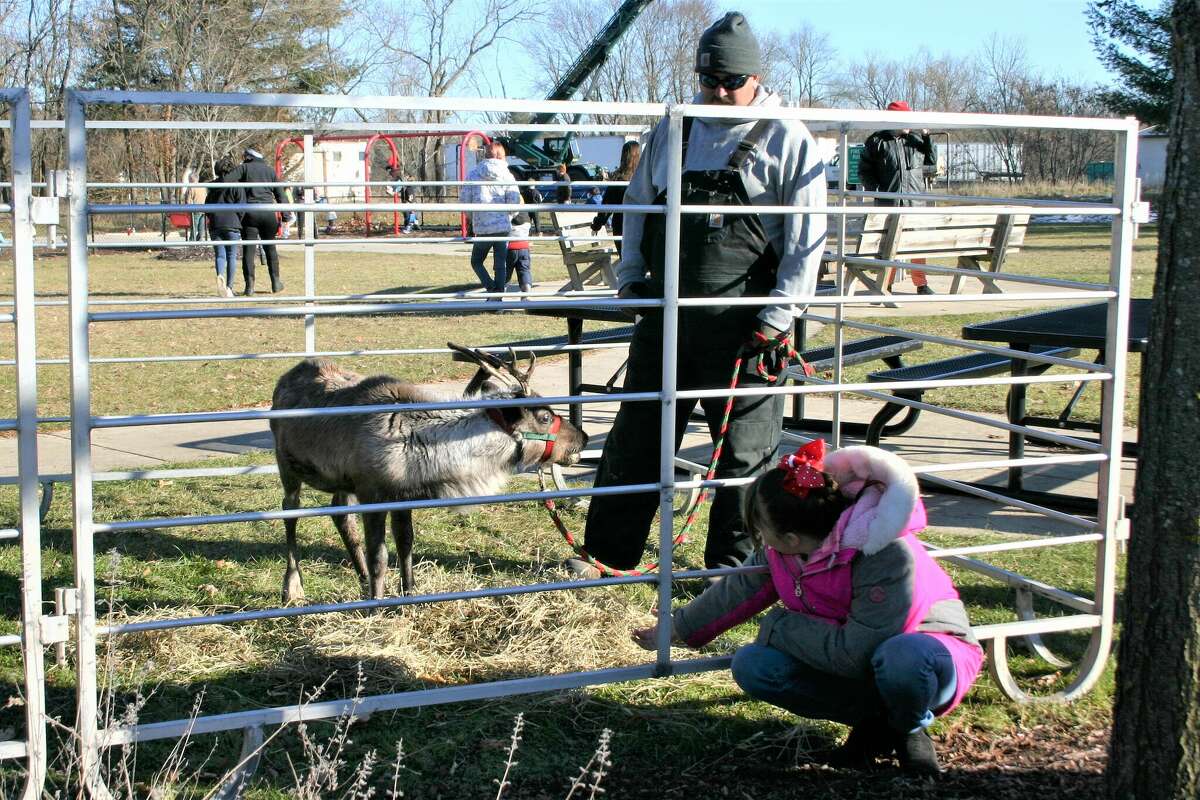The annual Evergreen Festival in downtown Reed City kicked off the holiday season this past weekend with a holiday decorating contest, a lighted parade and visits with Santa and his reindeer.