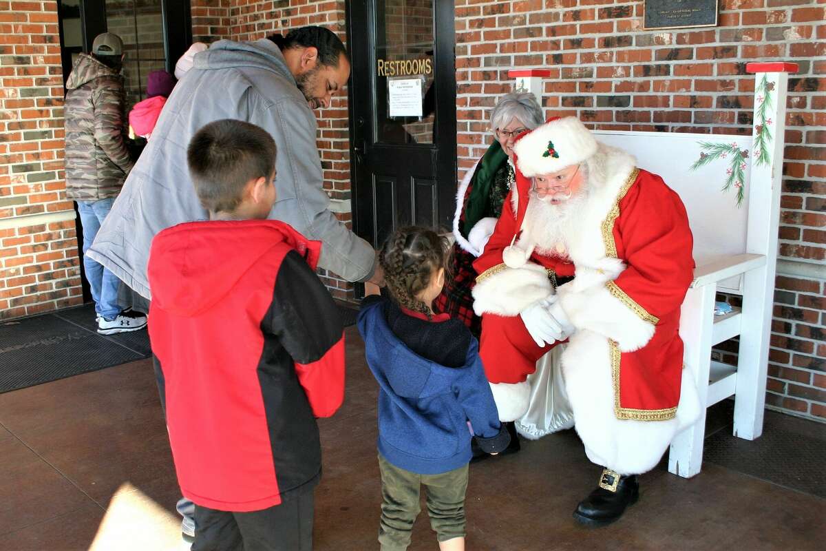 The annual Evergreen Festival in downtown Reed City kicked off the holiday season this past weekend with a holiday decorating contest, a lighted parade and visits with Santa and his reindeer.