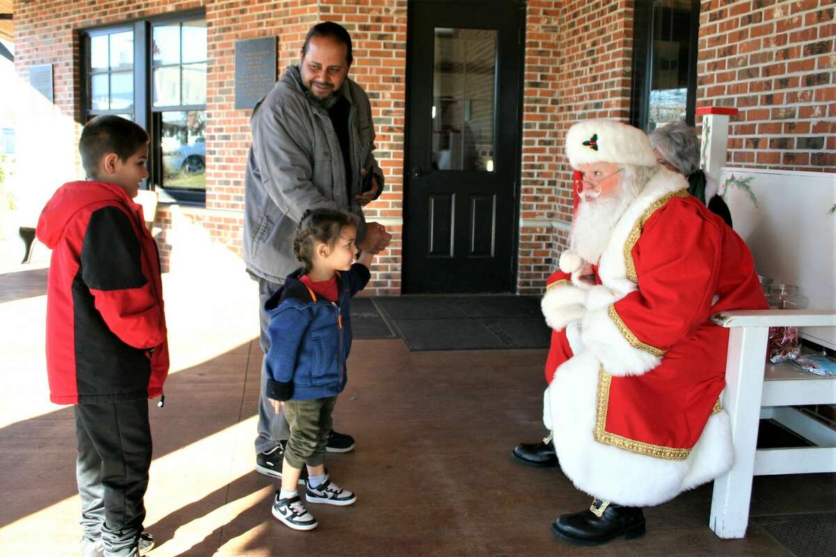 The annual Evergreen Festival in downtown Reed City kicked off the holiday season this past weekend with a holiday decorating contest, a lighted parade and visits with Santa and his reindeer.