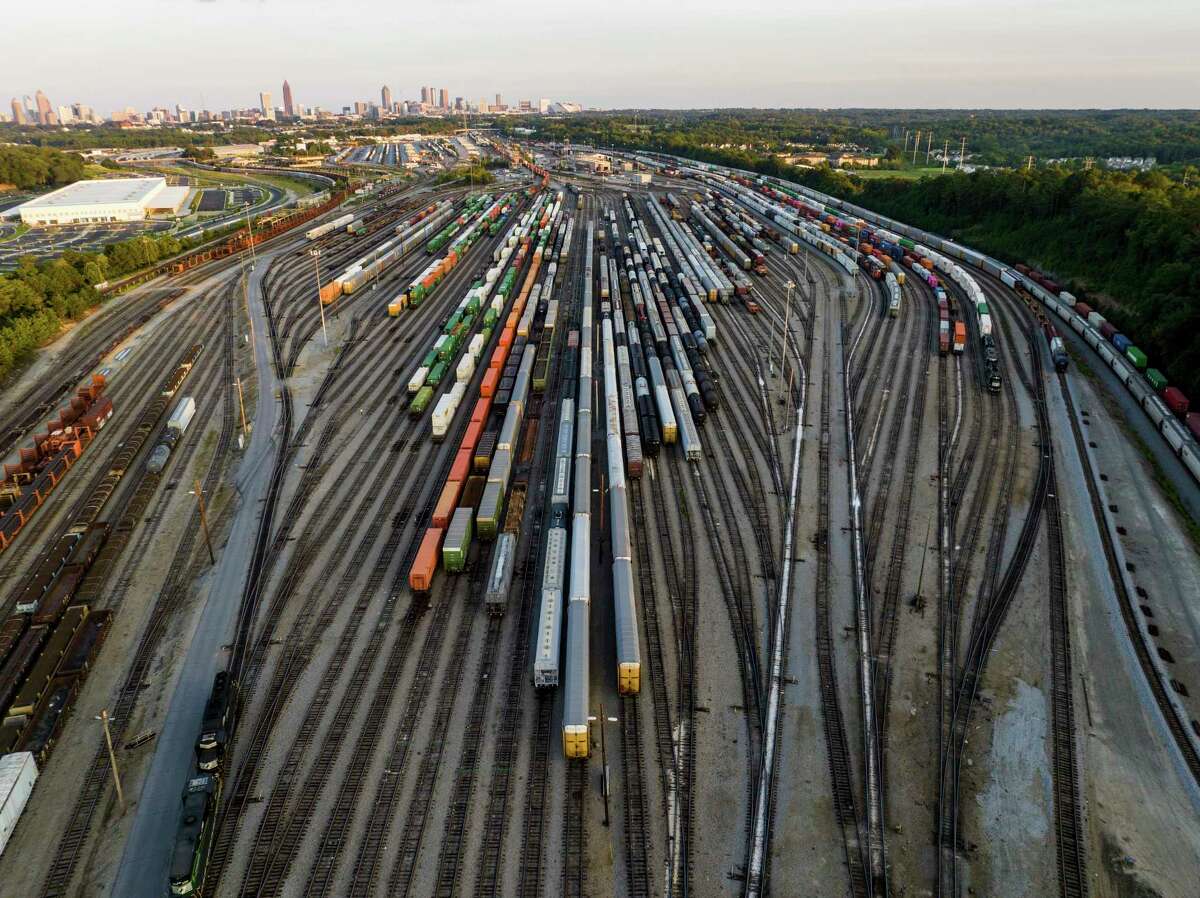 FILE - Freight train cars sit in a Norfolk Southern rail yard on Sept. 14, 2022, in Atlanta. 