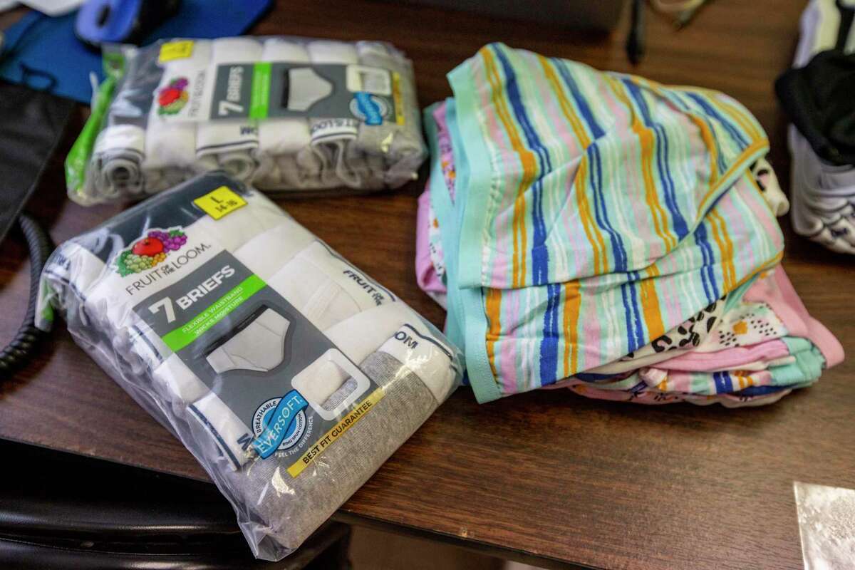 New underwear sits on a desk Thursday at the Center for Refugee Services. Agudas Achim Social Action Committee sponsored a community event called “Undies for Kids,” where nearly 40 volunteers from the Jewish and Muslim communities packaged more than 2,000 pairs of underwear for Afghan refugee children who receive aid from the center.