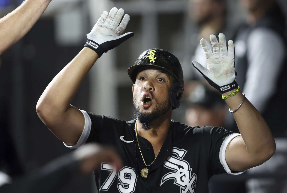 Chicago White Sox first baseman Jose Abreu is congratulated in the dugout after hitting a solo home run in the eighth inning against the Colorado Rockies at Guaranteed Rate Field on Tuesday, Sept. 13, 2022, in Chicago.