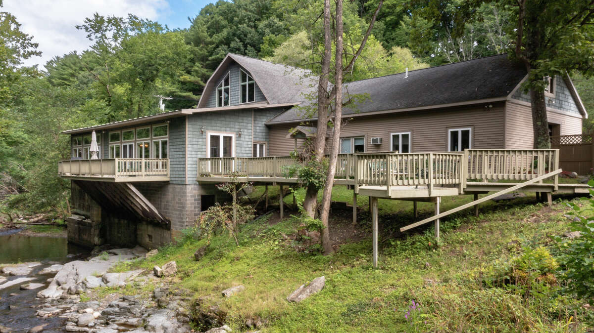Own a unique piece of history, nestled in 15 Rensselaer County acres at 1435 Schodack Valley Road, Schodack. This restored gristmill from the late 1800s has lovely details, but I'm particularly taken with the green painted brickwork and stained glass windows in the living room. One of the most impressive features is in the basement, where you will find the original mill wheels. The kitchen was designed with hospitality in mind, with high ceilings, a large granite island and an equally impressive Thermador range. There are five bedrooms and four and a half bathrooms in the nearly 5,000 square foot home – with one bedroom and one bathroom in a guest wing, complete with kitchenette. The outdoor patio overlooks Moordener Creek. Schodack schools. Tax: $6,950. Listing price: $624,700. For more information, contact Karen Westman, of Berkshire Hathaway HomeServices Blake, at 518-366-7788.