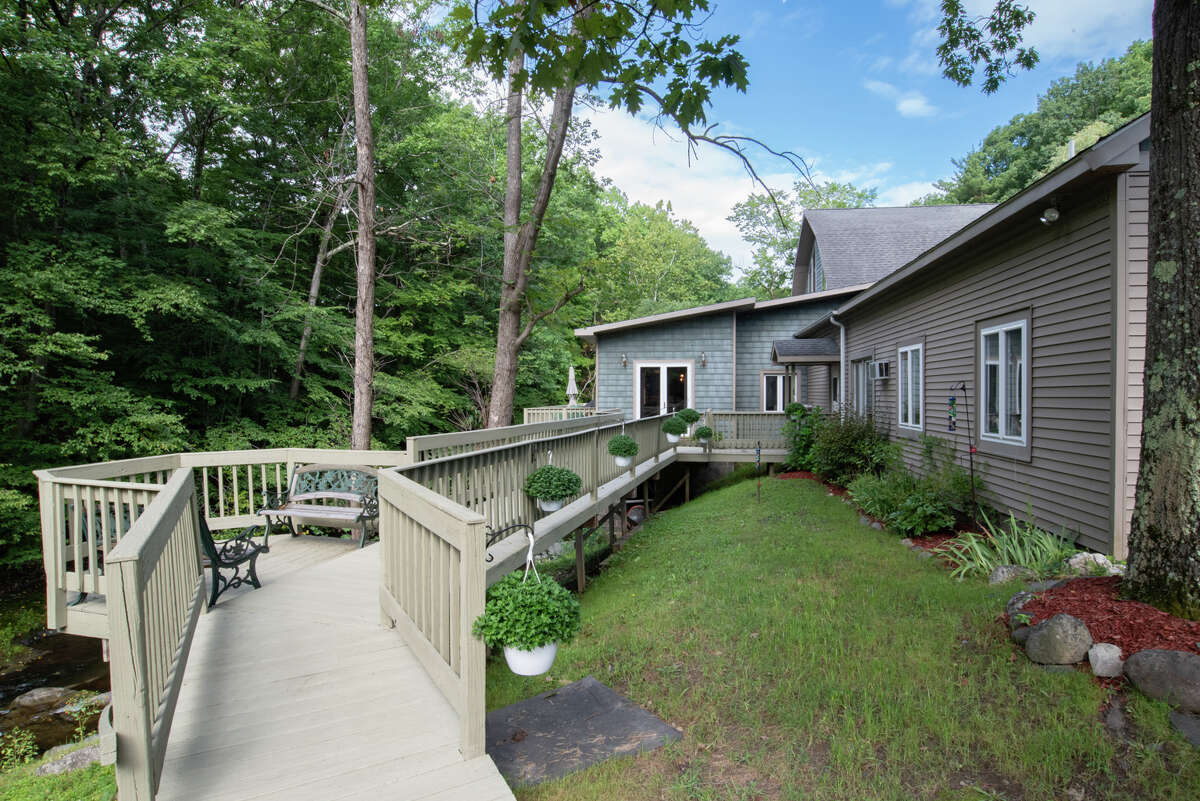 Own a unique piece of history, nestled in 15 Rensselaer County acres at 1435 Schodack Valley Road, Schodack. This restored gristmill from the late 1800s has lovely details, but I'm particularly taken with the green painted brickwork and stained glass windows in the living room. One of the most impressive features is in the basement, where you will find the original mill wheels. The kitchen was designed with hospitality in mind, with high ceilings, a large granite island and an equally impressive Thermador range. There are five bedrooms and four and a half bathrooms in the nearly 5,000 square foot home – with one bedroom and one bathroom in a guest wing, complete with kitchenette. The outdoor patio overlooks Moordener Creek. Schodack schools. Tax: $6,950. Listing price: $624,700. For more information, contact Karen Westman, of Berkshire Hathaway HomeServices Blake, at 518-366-7788.