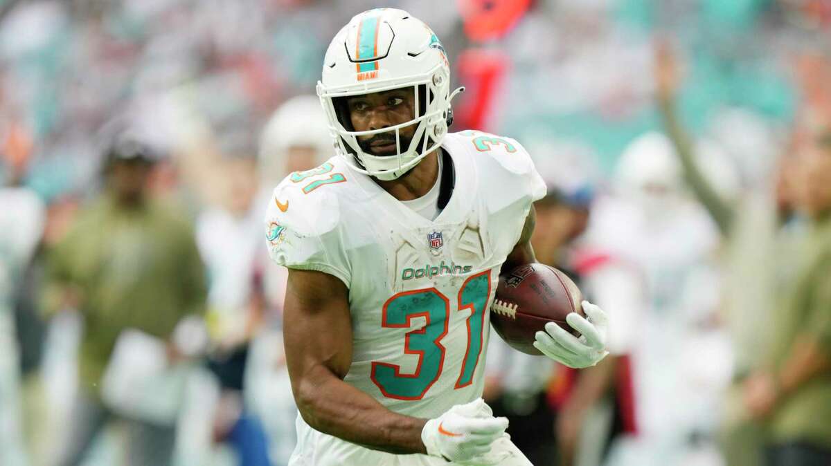 Miami Dolphins running back Raheem Mostert (31) runs for a touchdown during the second half of an NFL football game against the Cleveland Browns, Sunday, Nov. 13, 2022, in Miami Gardens, Fla. (AP Photo/Wilfredo Lee)
