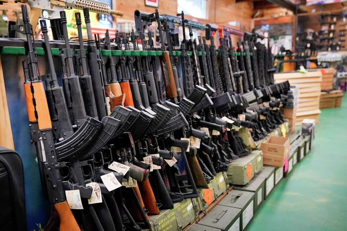 Semi-automatic rifles on display at a gun shop in Auburn, Maine. President Joe Biden and congressional Democrats, reacting to a recent string of mass shootings, hope to enact gun control measures during the lame-duck session of Congress. A newly elected Republican majority will take control of the House in January.