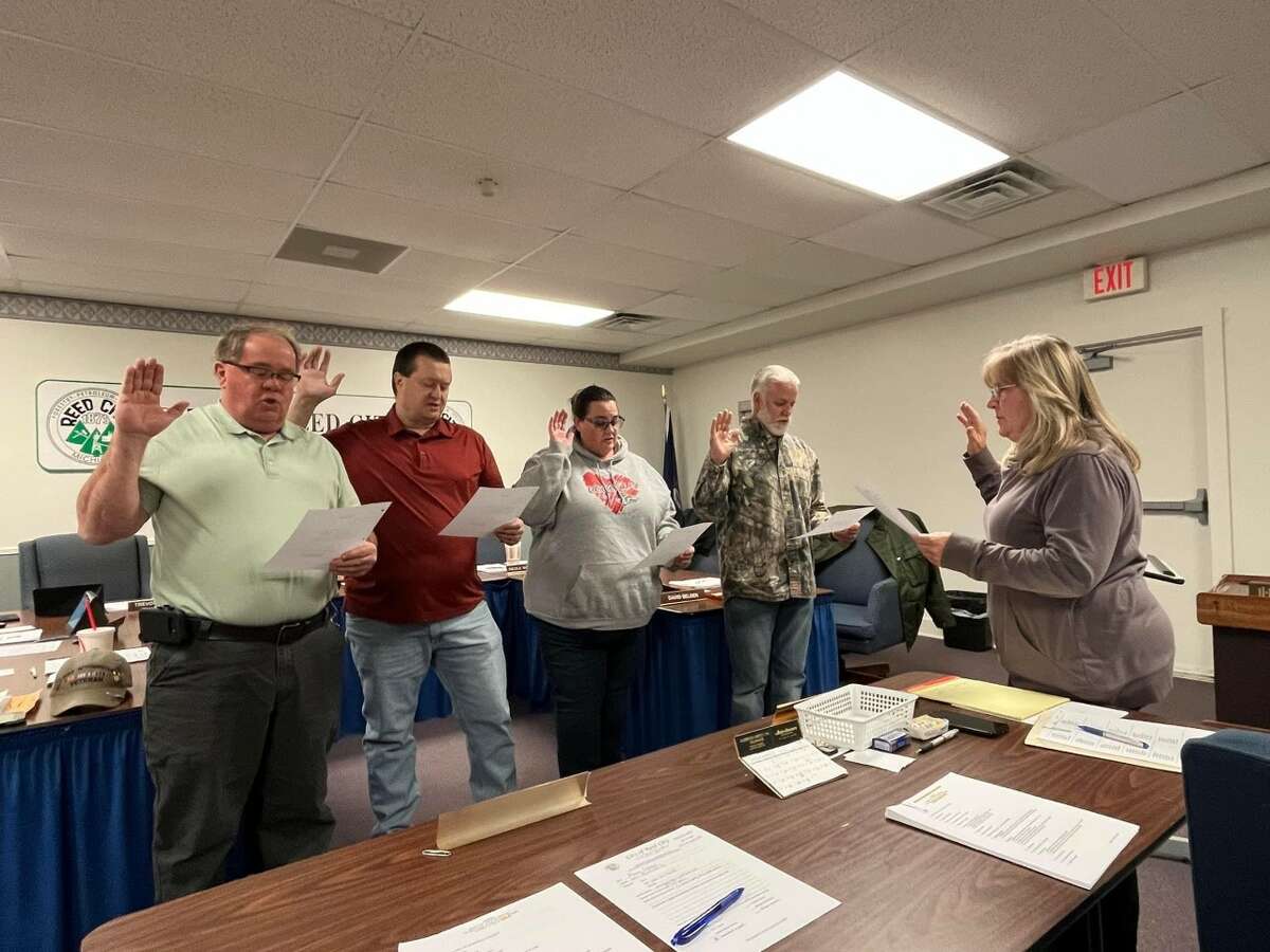 Reed City clerk Jackie Beam (far left) administers the oath of office to newly elected city council members David Belden (far right), Brad Nixon (center, right), Nicole Woodside (center) and Trevor Guiles (center, left).