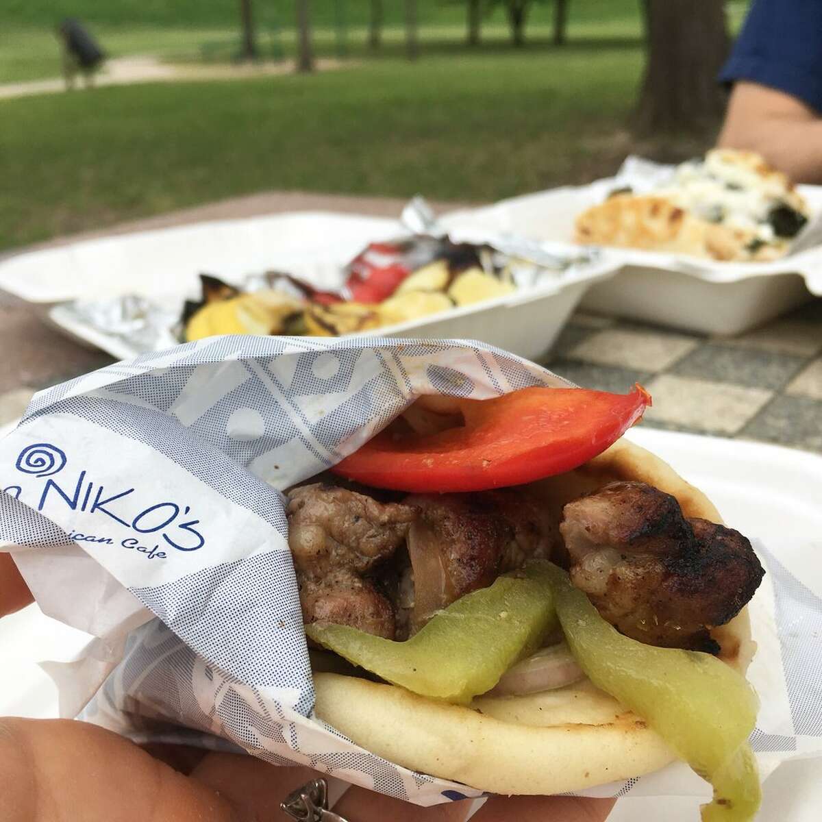 Mini pork pita sandwich and side of chargrilled veggies from Niko Niko's in Houston.