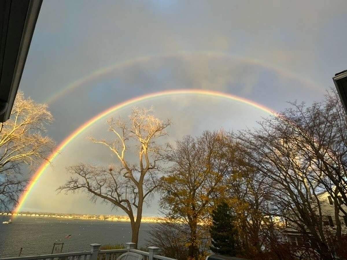 Stamford resident Diana Hughes captured photographs of a double rainbow that she said appeared over Stamford Harbor Monday morning and lingered in the sky for around 20 minutes before fading away.