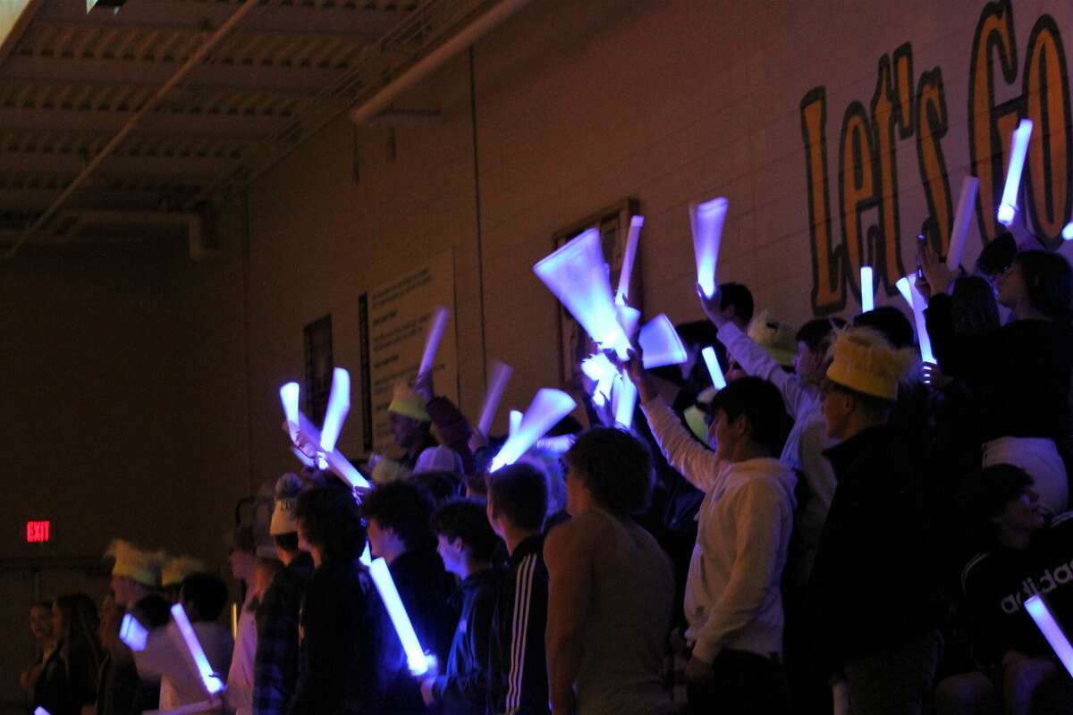 The Manistee student section makes noise during starting lineups before a game against LeRoy Pine River on Nov. 28 at Manistee High School. 