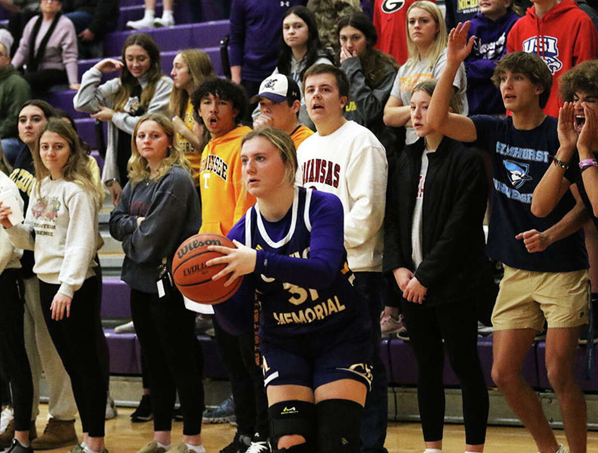 CM's Olivia Durbin gets set to launch one of her six 3-pointers in the first quarter while Mascoutah's student section watches during a MVC game Monday night in Mascoutah.
