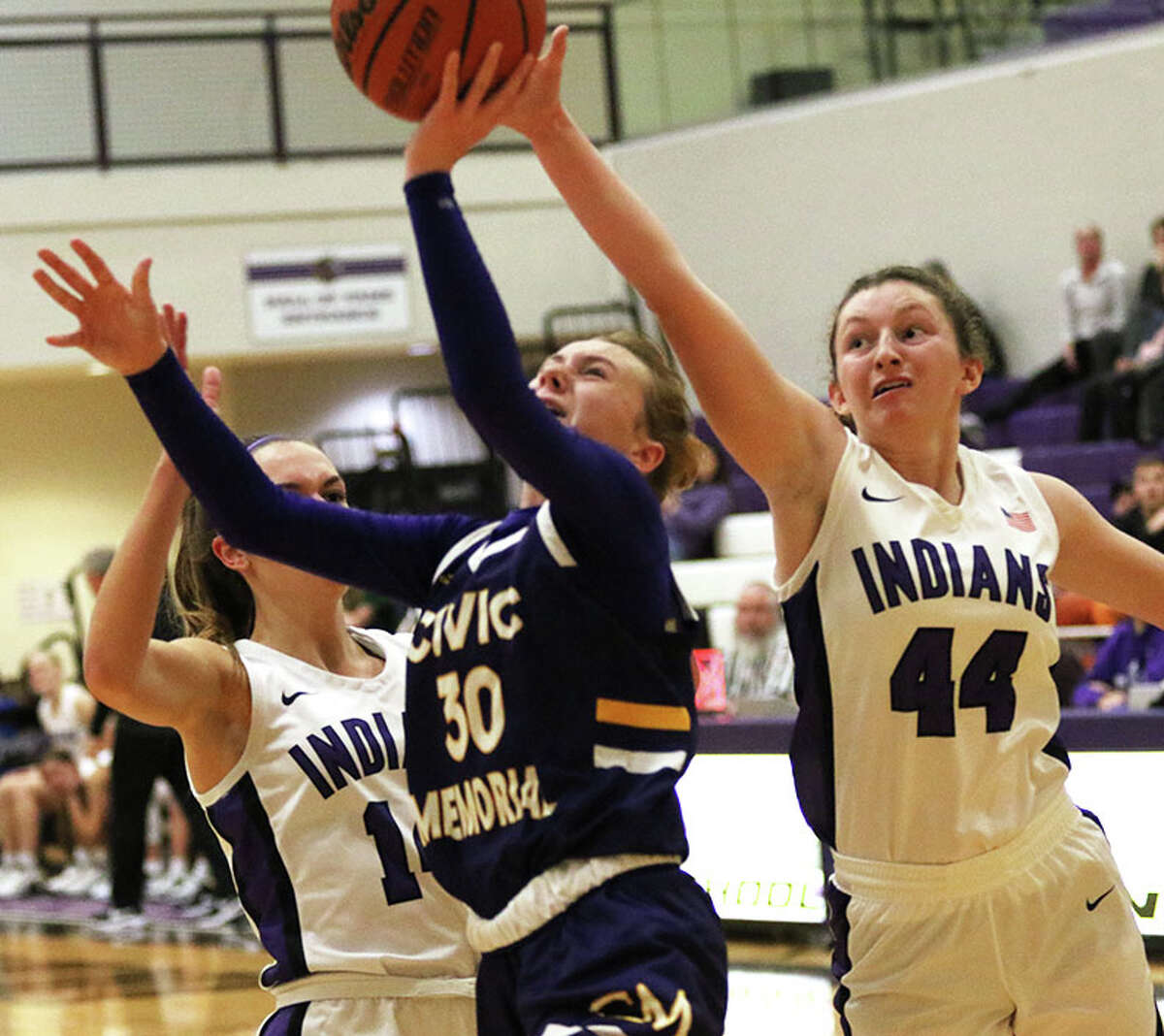 CM's Marlee Durbin (30) scores off a steal after beating Mascoutah's Bella Hart to the basket in the final minute of the third quarter of a MVC game Monday night in Mascoutah.