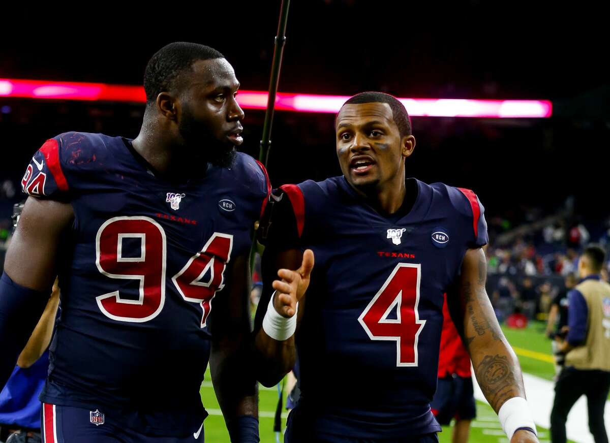 Houston Texans defensive end Charles Omenihu (94) and Houston Texans quarterback Deshaun Watson (4) walk off the field following the Texans 28-22 win over the New England Patriots at NRG Stadium on Sunday, Dec. 1, 2019, in Houston.